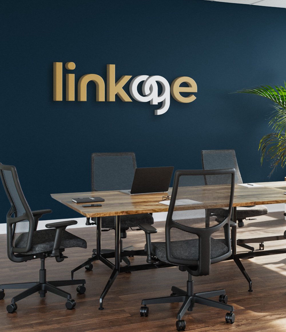 LINKAGE conference room with logo on the wall and modern office furniture